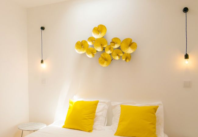 double room for adults with wall decoration in a rental accommodation